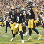 
              Pittsburgh Steelers quarterback Kenny Pickett (8) celebrates beside teammates after scoring a touchdown against the New York Jets during the second half of an NFL football game, Sunday, Oct. 2, 2022, in Pittsburgh. (AP Photo/Don Wright)
            