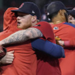 
              Boston Red Sox's Alex Verdugo, front right, and teammates embrace following the team's final regular season baseball game, against the Tampa Bay Rays on Wednesday, Oct. 5, 2022, in Boston. (AP Photo/Steven Senne)
            