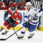 
              Tampa Bay Lightning center Brayden Point (21) takes the puck down the ice followed by Florida Panthers center Anton Lundell (15) during the first period of an NHL hockey game, Friday, Oct. 21, 2022, in Sunrise, Fla. (AP Photo/Wilfredo Lee )
            