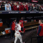 
              St. Louis Cardinals' Corey Dickerson leaves the dugout following Game 2 of the team's NL wild-card baseball playoff series against the Philadelphia Phillies, Saturday, Oct. 8, 2022, in St. Louis. The Phillies won 2-0 and advanced to the NL Division Series against the Atlanta Braves. (AP Photo/Jeff Roberson)
            