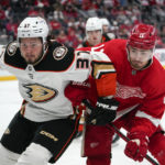 
              Anaheim Ducks center Mason McTavish (37) and Detroit Red Wings right wing Filip Zadina (11) battle for position in the second period of an NHL hockey game Sunday, Oct. 23, 2022, in Detroit. (AP Photo/Paul Sancya)
            