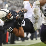 
              Penn State tight end Brenton Strange (86) dives into the end zone to score a touchdown against Northwestern during the first half of an NCAA college football game, Saturday, Oct. 1, 2022, in State College, Pa. (AP Photo/Barry Reeger)
            