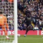 
              Arsenal's Bukayo Saka scores their side's first goal of the game during the Premier League match betweem Leeds United and Arsenal at Elland Road in Leeds, Britain, Sunday Oct. 16, 2022. (Tim Goode/PA via AP)
            