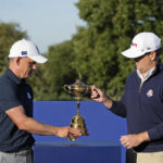 
              European Captain Luke Donald, left, and United States Captain Zach Johnson pose with the Ryder Cup trophy before an exhibition match on the occasion of The Year to Go event at the Marco Simone course that will host the 2023 Ryder Cup, in Guidonia Montecelio, near Rome, Italy, Monday, Oct. 3, 2022. (AP Photo/Alessandra Tarantino)
            
