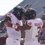 
              Maryland quarterback Taulia Tagovailoa (3) celebrates with Corey Dyches (84) after Tagovailoa ran in for a touchdown during the first half of an NCAA college football game against Indiana, Saturday, Oct. 15, 2022, in Bloomington, Ind. (AP Photo/Darron Cummings)
            