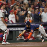 
              Houston Astros' Jeremy Pena scores on an RBI double hit by Houston Astros' Yordan Alvarez during the first inning in Game 2 of baseball's World Series between the Houston Astros and the Philadelphia Phillies on Saturday, Oct. 29, 2022, in Houston. (AP Photo/David J. Phillip)
            