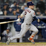 
              Houston Astros Alex Bregman (2) follows through on a base hit to drive in a run against the New York Yankees during the seventh inning of Game 4 of an American League Championship baseball series, Sunday, Oct. 23, 2022, in New York. (AP Photo/John Minchillo)
            