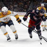 
              Columbus Blue Jackets forward Boone Jenner right, works for the puck against Nashville Predators defenseman Dante Fabbro during the second period of an NHL hockey game in Columbus, Ohio, Thursday, Oct. 20, 2022. (AP Photo/Paul Vernon)
            