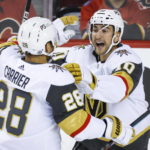 
              Vegas Golden Knights forward William Carrier, left, celebrates his goal against the Calgary Flames with forward Nicolas Roy during the first period of an NHL hockey game Tuesday, Oct. 18, 2022, in Calgary, Alberta. (Jeff McIntosh/The Canadian Press via AP)
            