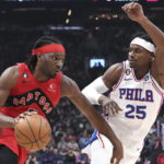 
              Toronto Raptors' Precious Achiuwa, left, drives against Philadelphia 76ers' Danuel House Jr. during first-half NBA basketball game action in Toronto, Friday, Oct. 28, 2022. (Chris Young/The Canadian Press via AP)
            