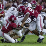 
              Alabama linebacker Chris Braswell and defensive lineman DJ Dale tackle Texas A&M quarterback Haynes King (13) during the first half of an NCAA college football game, Saturday, Oct. 8, 2022, in Tuscaloosa, Ala. (AP Photo/Vasha Hunt)
            