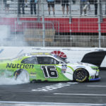 
              AJ Allmendinger (16) does a burnout after winning a NASCAR Xfinity auto race at Charlotte Motor Speedway on Saturday, Oct. 8, 2022, in Concord, N.C. (AP Photo/Matt Kelley)
            