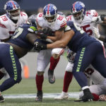 
              New York Giants running back Saquon Barkley (26) runs against the Seattle Seahawks during the second half of an NFL football game in Seattle, Sunday, Oct. 30, 2022. (AP Photo/Marcio Jose Sanchez)
            