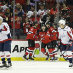 
              New Jersey Devils right wing Nathan Bastian (14) celebrates with teammates after scoring a goal in the first period of an NHL hockey game against the Washington Capitals, Monday, Oct. 24, 2022, in Newark, N.J. (AP Photo/Adam Hunger)
            