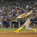 
              San Diego Padres' Jake Cronenworth connects for a solo home run against the Los Angeles Dodgers during the eighth inning in Game 2 of a baseball NL Division Series, Wednesday, Oct. 12, 2022, in Los Angeles. (AP Photo/Mark J. Terrill)
            