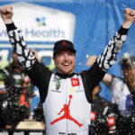 
              FILE - Kurt Busch celebrates in victory lane after winning a NASCAR Cup Series auto race at Kansas Speedway in Kansas City, Kan., Sunday, May 15, 2022.   Busch announced Saturday, Oct. 15 he will miss the rest of this season with a concussion and will not compete full-time in 2023.  The 44-year-old made his announcement at Las Vegas Motor Speedway, his home track and where he launched his career on the bullring as a child. He choked up when he said doctors told him “it is best for me to ‘shut it down.'” (AP Photo/Colin E. Braley, File)
            