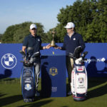 
              European Captain Luke Donald, left, and United States Captain Zach Johnson pose with the Ryder Cup trophy before an exhibition match on the occasion of The Year to Go event at the Marco Simone course that will host the 2023 Ryder Cup, in Guidonia Montecelio, near Rome, Italy, Monday, Oct. 3, 2022. (AP Photo/Alessandra Tarantino)
            