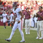 
              Alabama quarterback Bryce Young and coach Nick Saban celebrate a touchdown against Arkansas during the second half of an NCAA college football game Saturday, Oct. 1, 2022, in Fayetteville, Ark. Young left the game in the first half after an injury. (AP Photo/Michael Woods)
            