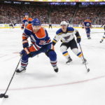 
              St. Louis Blues' Noel Acciari (52) chases Edmonton Oilers' Ryan Murray (28) during the third period of an NHL game in Edmonton, Alberta, Saturday, Oct. 22, 2022. (Jason Franson/The Canadian Press via AP)
            