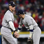 
              New York Yankees' Aaron Judge, left, and Josh Donaldson celebrate after the Yankees defeated the Cleveland Guardians in Game 4 of a baseball AL Division Series, Sunday, Oct. 16, 2022, in Cleveland. (AP Photo/David Dermer)
            