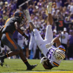 
              LSU tight end Mason Taylor (86) is upended on a pass reception near the goal line as Tennessee defensive back Jaylen McCollough closes in, in the first half of an NCAA college football game in Baton Rouge, La., Saturday, Oct. 8, 2022. (AP Photo/Gerald Herbert)
            