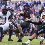 
              TCU quarterback Max Duggan (15) runs the ball during the second overtime period of an NCAA college football game against Oklahoma State in Fort Worth, Texas, Saturday, Oct. 15, 2022. (AP Photo/Sam Hodde)
            