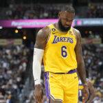 
              Los Angeles Lakers forward LeBron James heads to the bench in the second half of an NBA basketball game against the Denver Nuggets Wednesday, Oct. 26, 2022, in Denver. (AP Photo/David Zalubowski)
            