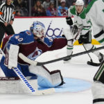 
              Colorado Avalanche goaltender Alexandar George (40) makes a glove save against the Dallas Stars during the first period of an NHL preseason hockey game Wednesday, Oct. 5, 2022, in Denver. (AP Photo/Jack Dempsey)
            