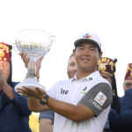 
              Tom Kim, of South Korea, displays the trophy after winning the Shriners Children's Open golf tournament, Sunday, Oct. 9, 2022, in Las Vegas. (AP Photo/David Becker)
            