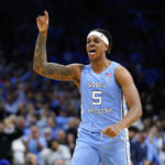 
              FILE - North Carolina's Armando Bacot reacts during the second half of the team's game against UCLA in the NCAA men's college basketball tournament March 25, 2022, in Philadelphia. The 6-foot-11, 235-pound Bacot led the team last season in scoring, rebounding, shooting percentage and blocks. He is the preseason pick for ACC player of the year for the league favorite Tar Heels.(AP Photo/Chris Szagola, File)
            