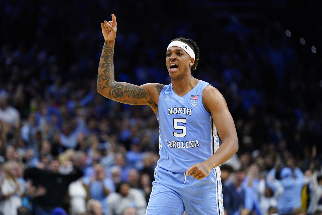 FILE - North Carolina's Armando Bacot reacts during the second half of the team's game against UCLA...