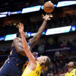 
              New Orleans Pelicans forward Zion Williamson drives to the basket against Utah Jazz forward Kelly Olynyk in the first half of an NBA basketball game in New Orleans, Sunday, Oct. 23, 2022. (AP Photo/Gerald Herbert)
            
