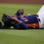 
              Houston Astros starting pitcher Framber Valdez (59) lies on the ground after missing the ball hit by New York Yankees Giancarlo Stanton (27) during the fourth inning in Game 2 of baseball's American League Championship Series, Thursday, Oct. 20, 2022, in Houston. (AP Photo/Kevin M. Cox)
            