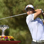 
              Tom Kim, of South Korea, watches the ball after his tee shot on the first hole during the final round of the Shriners Children's Open golf tournament, Sunday, Oct. 9, 2022, in Las Vegas. (AP Photo/David Becker)
            