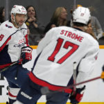 
              Washington Capitals' Alex Ovechkin (8) skates to the bench with Dylan Strome (17) after Ovechkin scored an empty-net goal against the Nashville Predators in the third period of an NHL hockey game Saturday, Oct. 29, 2022, in Nashville, Tenn. The Capitals won 3-0. (AP Photo/Mark Humphrey)
            