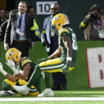 
              Green Bay Packers wide receiver Allen Lazard (13), left, celebrates after scoring a touchdown during an NFL game between the New York Giants and the Green Bay Packers at the Tottenham Hotspur stadium in London, Sunday, Oct. 9, 2022. (AP Photo/Kin Cheung)
            