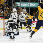 
              Nashville Predators' Yakov Trenin (13) celebrates a goal by teammate Tanner Jeannot (84) in the second period of an NHL hockey game against the Los Angeles Kings Tuesday, Oct. 18, 2022, in Nashville, Tenn. (AP Photo/Mark Humphrey)
            