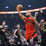
              Toronto Raptors guard Fred VanVleet (23) lays up the ball while defended by Cleveland Cavaliers forward Isaac Okoro (35) during the first half of an NBA basketball game Wednesday, Oct. 19, 2022, in Toronto. (Christopher Katsarov/The Canadian Press via AP)
            