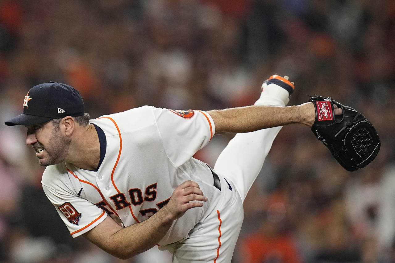 Houston Astros starting pitcher Justin Verlander (35) works during the fifth inning in Game 1 of ba...