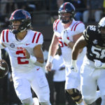 
              Mississippi quarterback Jaxson Dart (2) is chased by Vanderbilt defensive lineman Myles Cecil (58) during the first half of an NCAA college football game Saturday, Oct. 8, 2022, in Nashville, Tenn. (AP Photo/John Amis)
            