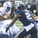 
              Air Force quarterback Haaziq Daniels carries the ball for a 1-yard touchdown as Utah State linebacker MJ Tafisi (2) defends during the first half of an NCAA college football game Saturday, Oct. 8, 2022, in Logan, Utah. (Eli Lucero/The Herald Journal via AP)
            