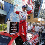 
              Kyle Larson celebrates after winning a NASCAR Cup Series auto race at Homestead-Miami Speedway, Sunday, Oct. 23, 2022, in Homestead, Fla. (AP Photo/Terry Renna)
            