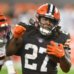 
              Cleveland Browns running back Kareem Hunt (27) is tackled by Cincinnati Bengals linebacker Logan Wilson (55) during the first half of an NFL football game in Cleveland, Monday, Oct. 31, 2022. (AP Photo/David Richard)
            