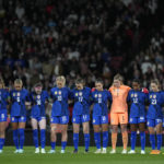 
              Team of US stands for a period of silence in respect to the stadium tragedy in Indonesia ahead the women's friendly soccer match between England and the US at Wembley stadium in London, Friday, Oct. 7, 2022. (AP Photo/Kirsty Wigglesworth)
            
