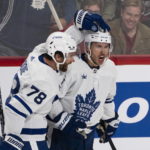 
              Toronto Maple Leafs' Michael Bunting, right, celebrates his goal against the Montreal Canadiens with TJ Brodie (78) during the first period of an NHL hockey game Wednesday, Oct. 12, 2022, in Montreal. (Paul Chiasson/The Canadian Press via AP)
            