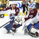 
              Colorado Avalanche goaltender Alexandar Georgiev (40) makes a save against the Vegas Golden Knights, next to Avalanche left wing J.T. Compher (37) during the second period of an NHL hockey game Saturday, Oct. 22, 2022, in Las Vegas. (AP Photo/Chase Stevens)
            