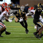 
              Missouri wide receiver Barrett Banister (11) dives with the ball as Georgia defensive lineman Tramel Walthour (90), linebacker Trezmen Marshall (15) and defensive back Kelee Ringo (5) defend during the first half of an NCAA college football game Saturday, Oct. 1, 2022, in Columbia, Mo. (AP Photo/L.G. Patterson)
            