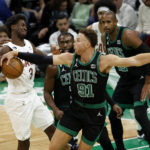 
              Boston Celtics' Blake Griffin knocks the ball away from Cleveland Cavaliers' Caris LeVert during the first quarter of an NBA basketball game Friday, Oct. 28, 2022, in Boston. (AP Photo/Winslow Townson)
            