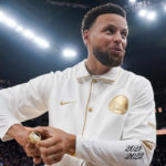 
              Golden State Warriors guard Stephen Curry reacts after receiving his 2021-2022 NBA championship ring before the team's basketball game against the Los Angeles Lakers in San Francisco, Tuesday, Oct. 18, 2022. (AP Photo/Godofredo A. Vásquez)
            