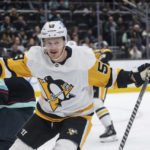 
              Pittsburgh Penguins forward Jake Guentzel celebrates after scoring a goal during the second period against the Seattle Kraken of an NHL hockey game, Saturday, Oct. 29, 2022, in Seattle. (AP Photo/Stephen Brashear)
            